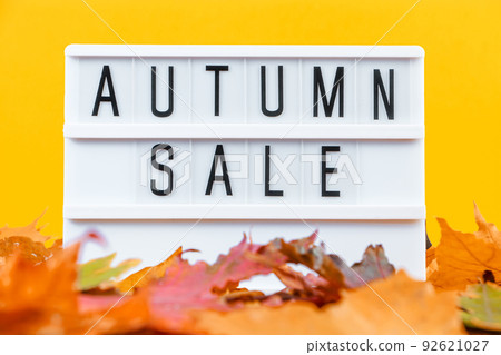 Autumn sale concept. Promotional discount banner on the background of yellow fallen leaves. Autumn sale concept. Promotional discount banner on the background of yellow fallen leaves. 92621027