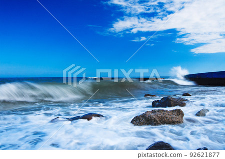 Waves breaking in the Black Sea on the rocky Bzhny coast of the Crimean peninsula, on a bright sunny day. Pure and wonderful nature of Crimea. Ukraine, territory occupied by the Russian Federation. Waves breaking in the Black Sea on the rocky Bzhny coast of the Crimean peninsula, on a bright sunny day. Pure and wonderful nature of Crimea. Ukraine, territory occupied by the Russian Federation. 92621877
