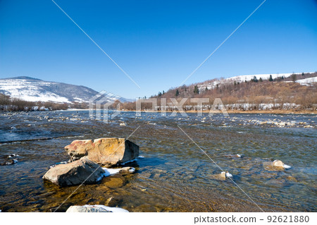 Beautiful landscape of the Carpathian Mountains National Park in Ukraine, with clear water of a wonderful river, blue sky as a copy space. 92621880