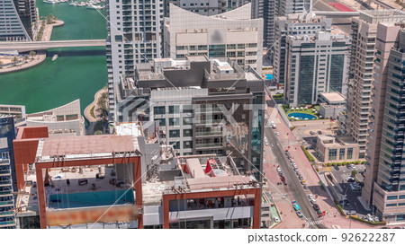 Dubai Marina luxury district with skyscrapers and towers around canal aerial timelapse 92622287