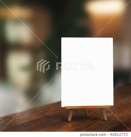 White paper counter menu on blurred restaurant background 92622715