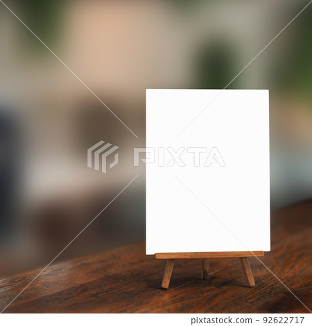 White paper counter menu on blurred restaurant background 92622717