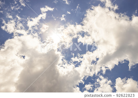Midsummer blue sky, white clouds and the shining sun 92622823