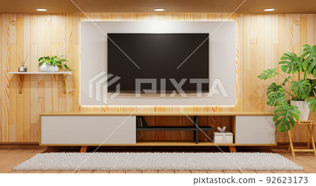 TV above wooden cabinet in modern empty room with plants carpet and downlight lamp on wooden background. Japanese style theme. Architecture and interior concept. 3D illustration rendering 92623173