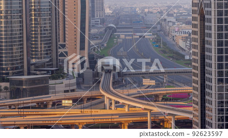 Busy Sheikh Zayed Road aerial timelapse, metro railway and modern skyscrapers around in luxury Dubai city. 92623597
