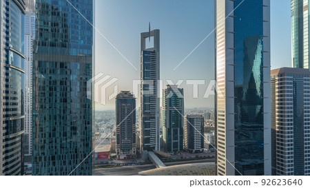 Aerial view of Dubai International Financial District with many skyscrapers timelapse. 92623640