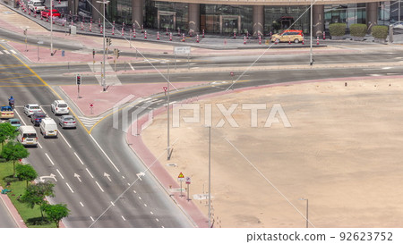 Bussy traffic on the road intersection in Dubai business bay district aerial timelapse, UAE 92623752