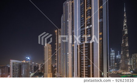 Tallest skyscrapers in downtown dubai located on bouleward street near shopping mall aerial all night timelapse. Tallest skyscrapers in downtown dubai located on bouleward street near shopping mall aerial all night timelapse. 92623810