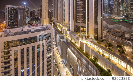 Tallest skyscrapers in downtown dubai located on bouleward street near shopping mall aerial night timelapse. 92623828