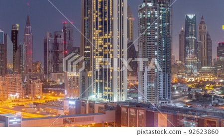 Panorama of the tall buildings around Sheikh Zayed Road and DIFC district aerial night to day timelapse in Dubai Panorama of the tall buildings around Sheikh Zayed Road and DIFC district aerial night to day timelapse in Dubai 92623860