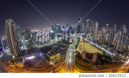 Panorama of Bay Avenue with modern towers residential development in Business Bay aerial all night timelapse, Dubai 92623912