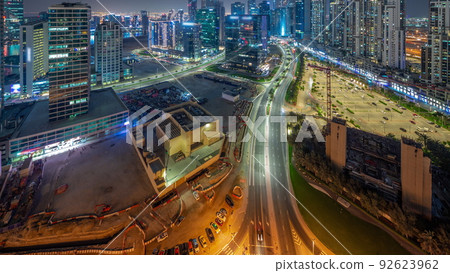 Water canal with modern towers residential development in Business Bay aerial panoramic night timelapse, Dubai Water canal with modern towers residential development in Business Bay aerial panoramic night timelapse, Dubai 92623962