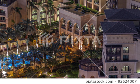 Aerial view of swimming pool in Old Town Island from above night timelapse. 92624007