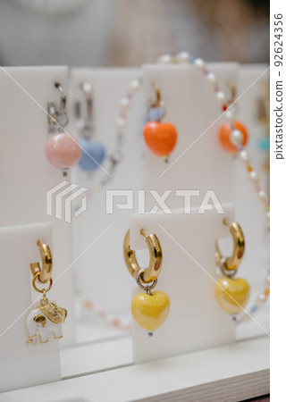 Shop window with necklaces and jewelry. Custome jewelry on display 92624356