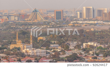 Skyline of the Dubai city with modern skyscrapers in Deira and Zabeel district aerial timelapse 92624417