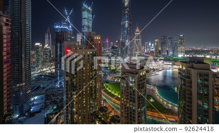 Dubai Downtown cityscape with tallest skyscrapers aerial night timelapse. 92624418