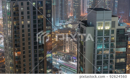 Aerial panoramic view of a big futuristic city night timelapse. Business bay and Downtown 92624560