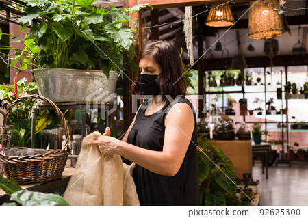 Florist small business owner. hispanic mid woman floral arrangement decoration. Florist small business owner. hispanic mid woman floral arrangement decoration. 92625300