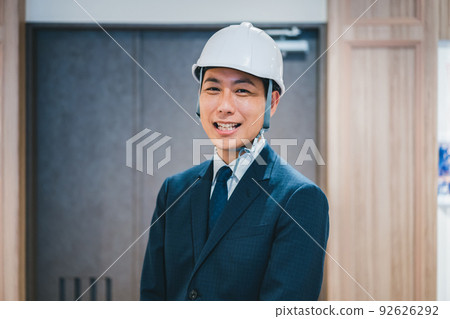 businessman wearing a helmet businessman wearing a helmet 92626292