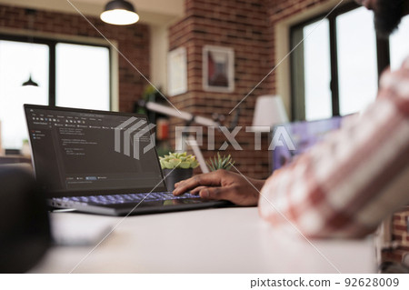 African american engineer programming app code, developing online software with cloud server and firewall security. Coding new user interface with binary code html program, web development. 92628009
