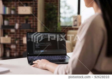 Software developer learning new program code on terminal window, using online cloud app server at home. Programming new user interface with css html script and application development. 92628010