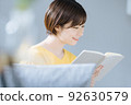 A woman reading 92630579