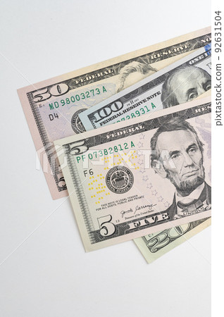5, 20, 50, 100 dollars banknotes at different angles. Close up of dollars on white background. 92631504