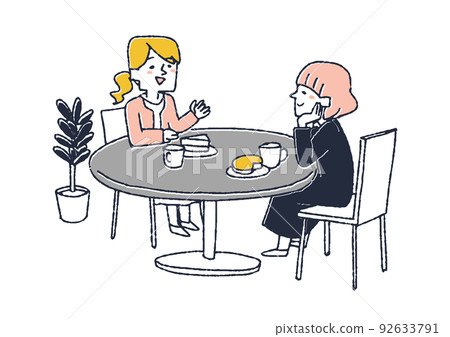 兩個女人坐在桌邊，在咖啡店或咖啡館裡愉快地聊天 92633791