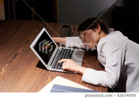 A woman tired from work 92634009