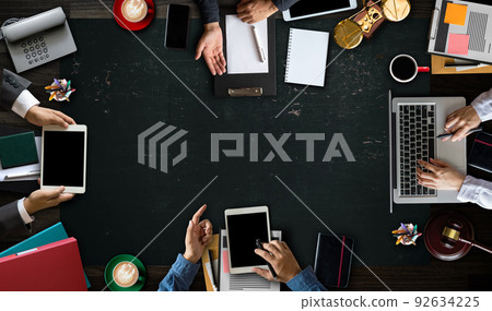 Top view Business and lawyers discussing contract papers with brass scale on desk in modern office. Law, legal services, advice, justice and law concept .. Top view Business and lawyers discussing contract papers with brass scale on desk in modern office. Law, legal services, advice, justice and law concept .. 92634225