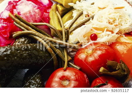 Pickled vegetables and sauerkraut, close up 92635117