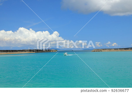 A ship entering the beautiful emerald green port of Uehara Port on Iriomote Island A ship entering the beautiful emerald green port of Uehara Port on Iriomote Island 92636677