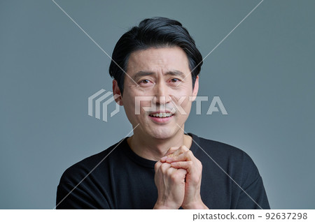 Men, 40s, 50s, middle-aged, black clothes, emotional expression Men, 40s, 50s, middle-aged, black clothes, emotional expression 92637298