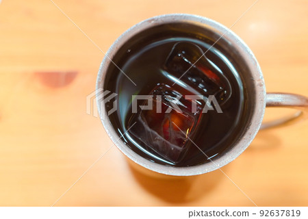 Iced coffee in a stainless steel mug Iced coffee in a stainless steel mug 92637819