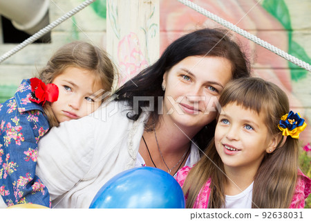 Happy laughing girl on grass. Smiling child outdoors Happy laughing girl on grass. Smiling child outdoors 92638031