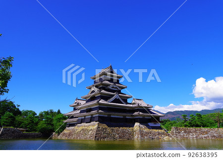 Matsumoto Castle with blue sky and white clouds Matsumoto Castle with blue sky and white clouds 92638395