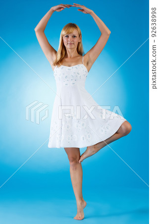 Young model beautiful girl on a blue background, clothing, advertising, posing Young model beautiful girl on a blue background, clothing, advertising, posing 92638998