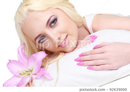 beauty portrait of a woman with a flower on white background 92639000