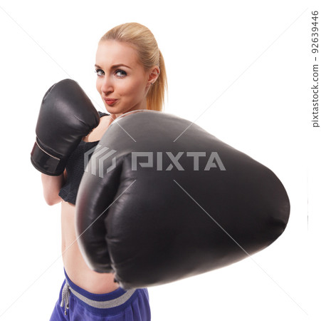 Isolated portrait of athletic Asian woman in black boxing gloves. Slim athletic girl in training clothes looking at camera. Vertical concept photo of sport, boxing, victory, rivalry theme Isolated portrait of athletic Asian woman in black boxing gloves. Slim athletic girl in training clothes looking at camera. Vertical concept photo of sport, boxing, victory, rivalry theme 92639446
