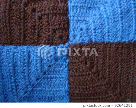 Crochet texture, colorful squares pattern. Crochet Knit Squares Crochet texture, colorful squares pattern. Crochet Knit Squares 92641291
