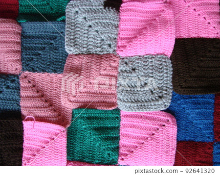 Crochet texture, colorful squares pattern. Crochet Knit Squares Crochet texture, colorful squares pattern. Crochet Knit Squares 92641320