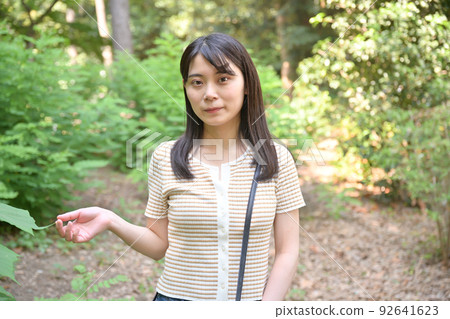Woman walking in the forest 92641623