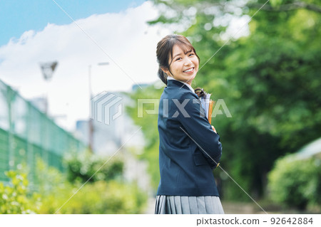 Portrait of a high school girl turning around in the park 92642884