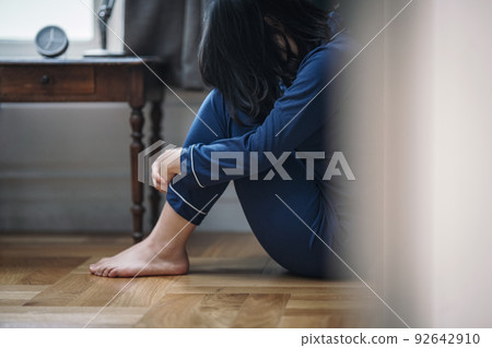 An image of a woman who is sad and depressed 92642910