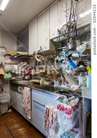 Dirty kitchen full of things, cluttered and unorganized 92644218