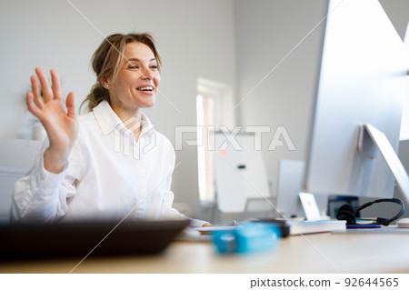 Business woman having video call meeting in office 92644565