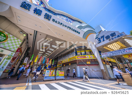 The cityscape of Tokyo, Japan, overlooking Kawasaki Ginryu-gai (Hokoten) in front of Kawasaki Station. bicycle dangerous driving 92645625
