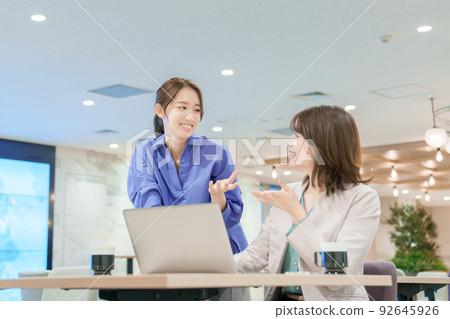 Young woman having a meeting Young woman having a meeting 92645926