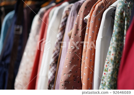 clothes of different colors and patterns 92646089