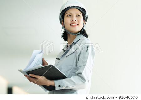 Young woman in construction management 92646576